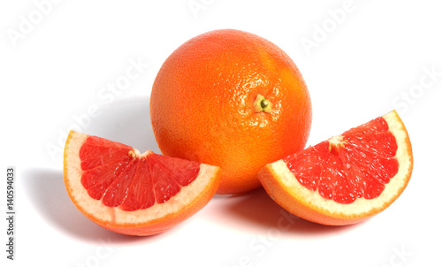 fresh grapefruit with piece isolated on white background