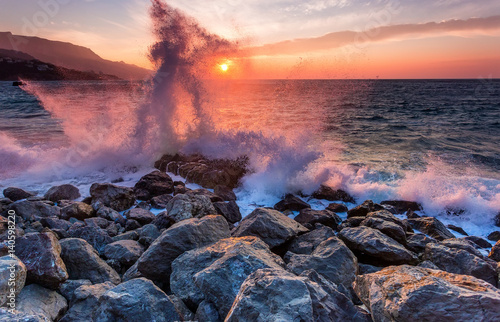 Amazing power of waves crashing against the rocks at dawn