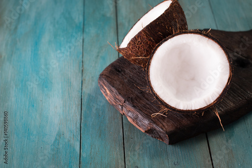 close up of a coconut on a wooden background