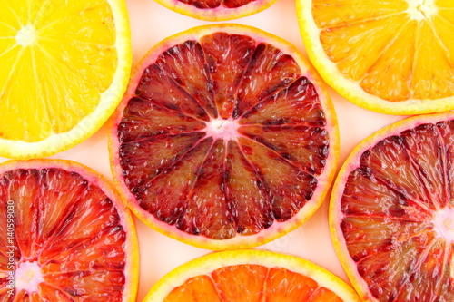 slices of fresh blood orange fruits food background texture
