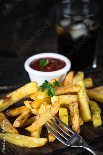Fried potato with ketchup sauce and cola. Fast food menu.