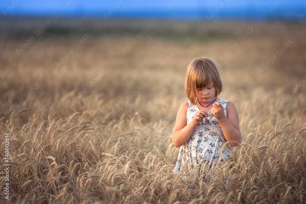 Funny girl dances in field with rye at sunset Funny girl dances in field with rye at sunset