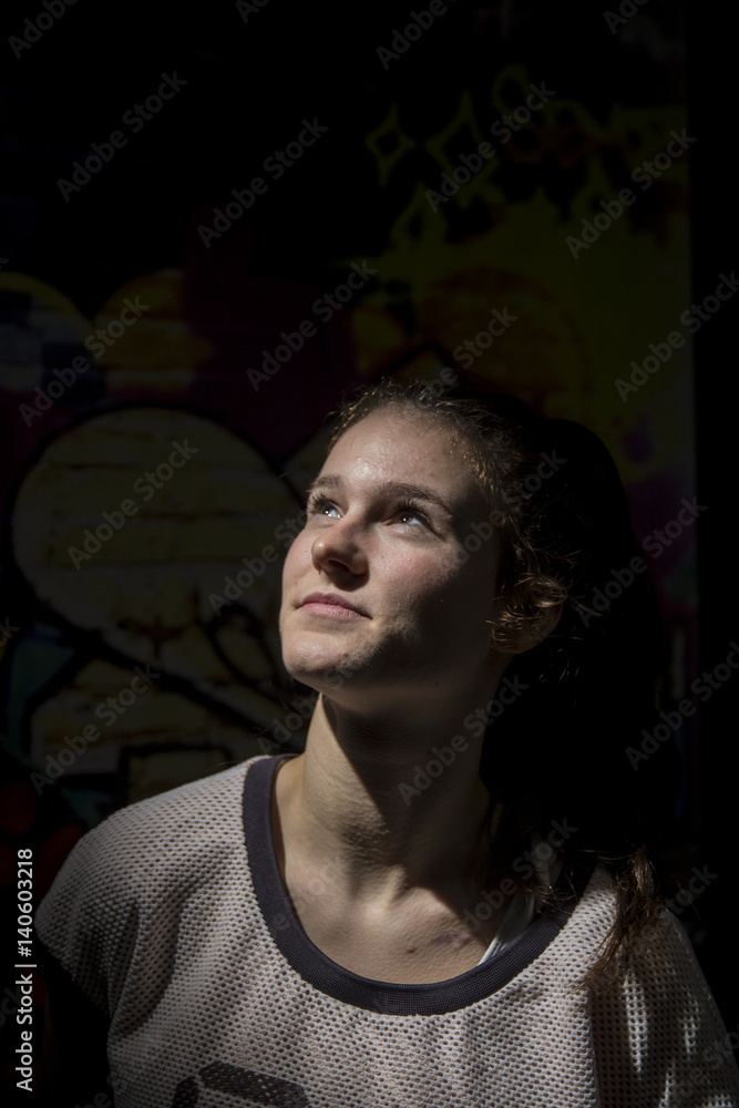 Fototapeta premium Portrait of a young girl with long hair in summer clothes
