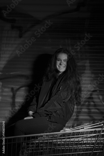 tough girl in front of Graffiti Wall 