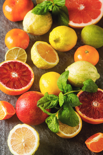 Citrus juice fruit and slices of orange  grapefruit  lemon  lime. Vitamin C. Black background