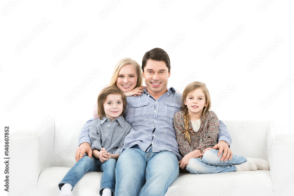 Happy family on the couch isolated.