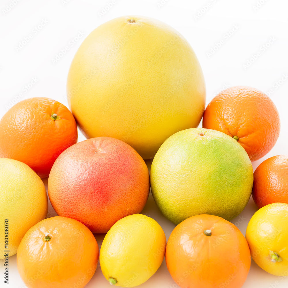 Fruits pattern made of lemon, orange, grapefruit, sweetie and pomelo on white background. Fruits pattern made of lemon, orange, grapefruit, sweetie and pomelo on white background.
