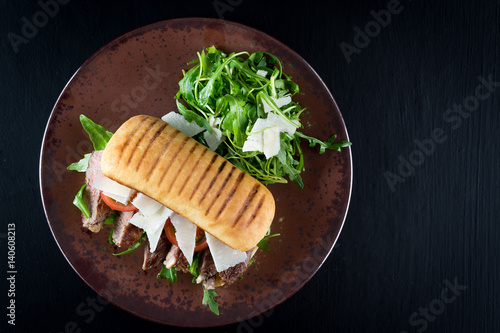 Obraz na płótnie grilled steak medium fresh baked ciabatta sandwich beer w salonie