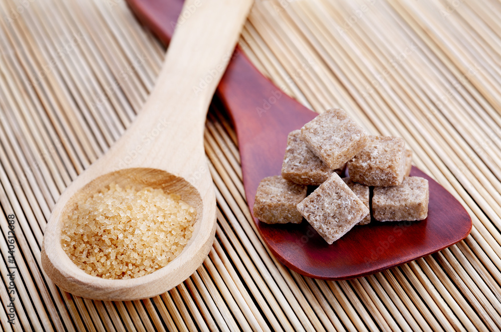 Wooden spoons with different kinds of brown sugar Wooden spoons with different kinds of brown sugar
