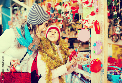 mother with daughter buying decorations for Xmas