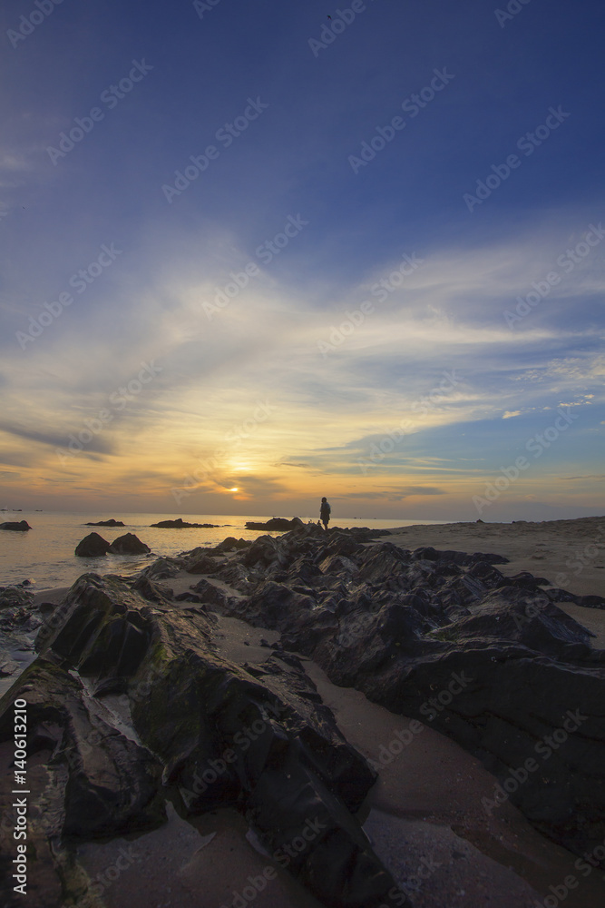 Landscape of sea beach which has fisherman and cloudy sky at dawn ; Samila beach, Songkhla, southern of Thailand