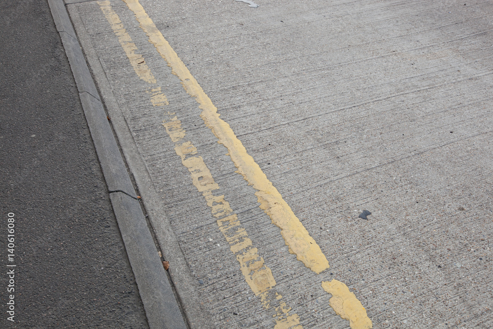 Fototapeta premium Close-Up of double yellow line on road