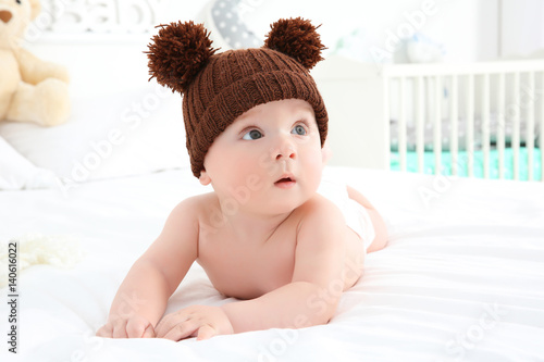 Cute baby wearing funny cap...
