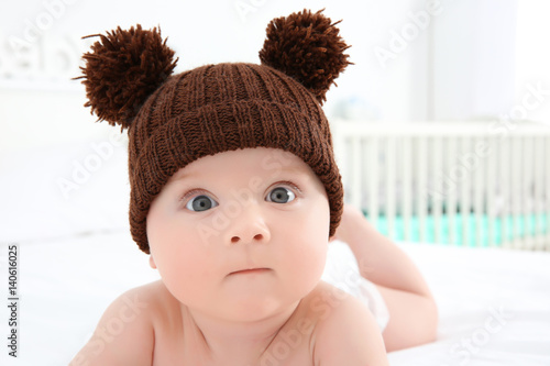 Cute baby wearing funny cap...