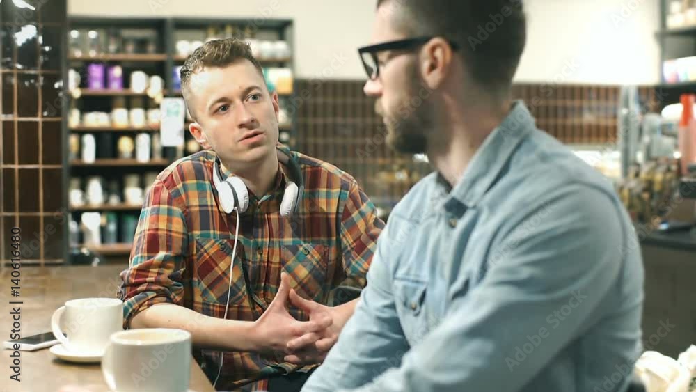 Two different men chatting with each other in the cafe, steadycam shot
Two different men chatting with each other in the cafe, steadycam shot