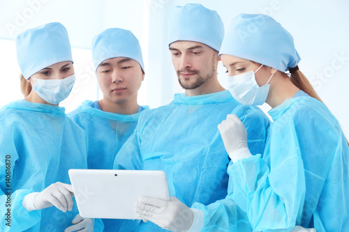 Young doctors with tablet c...