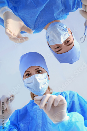 Young doctors in clinic, bo...