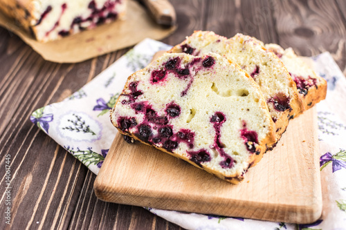 Homemade berry cake on rustic wooden background