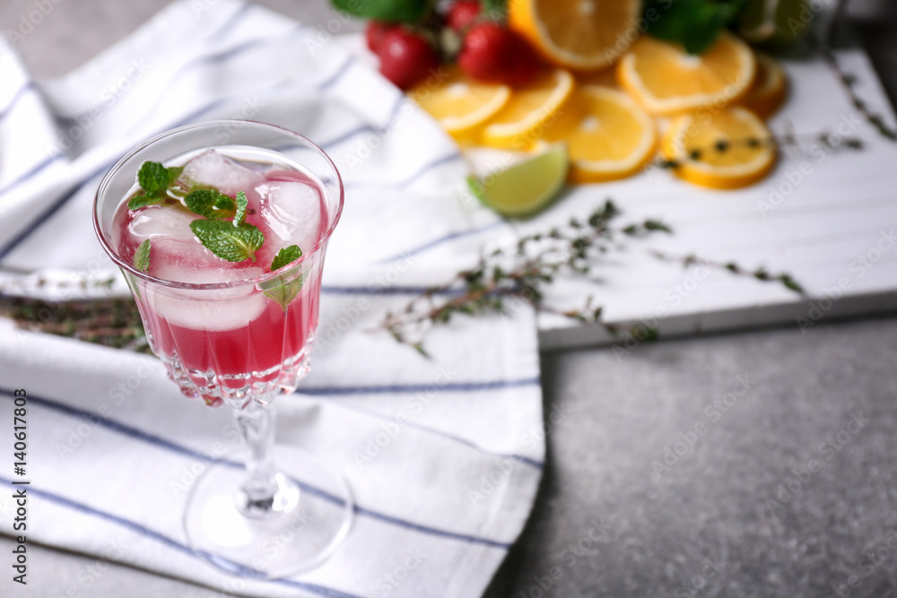 Glass of delicious wine spritzer on napkin Glass of delicious wine spritzer on napkin