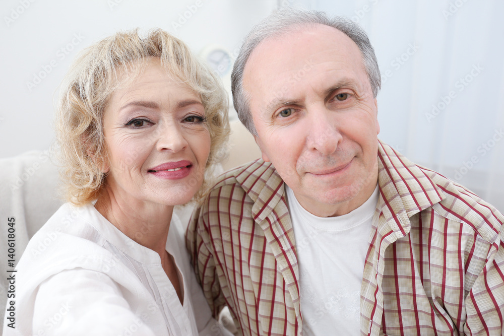 Closeup portrait of happy senior couple at home Closeup portrait of happy senior couple at home