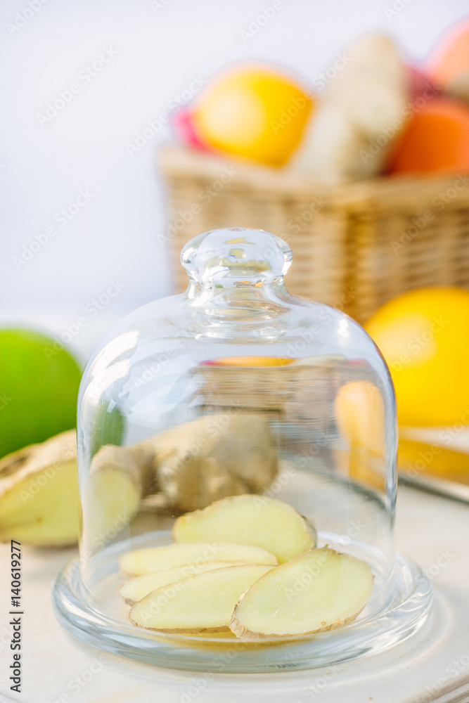 Slices of ginger root covered by glass cover. Slices of ginger root covered by glass cover.