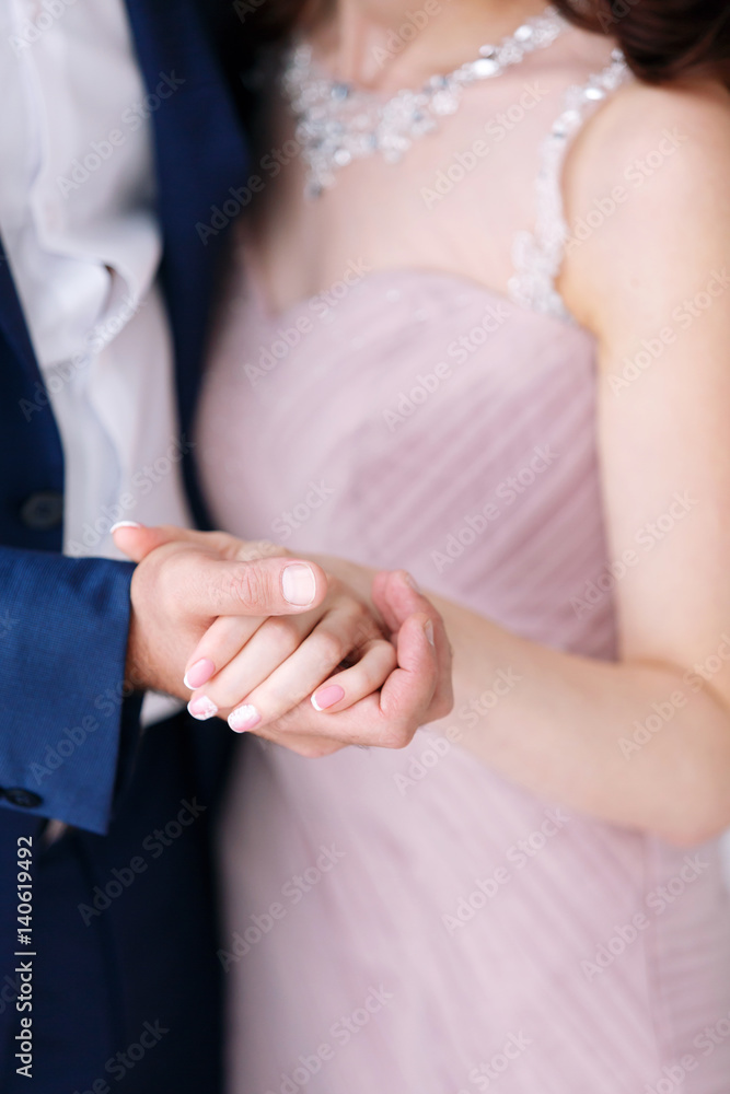 the groom holds the of the wife by a hand. Love concept, wedding day