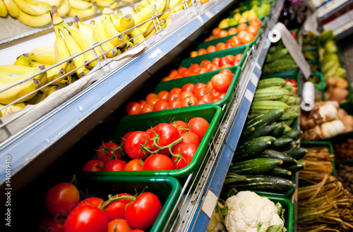 Bild auf Leinwand Various vegetables and fruits on display in supermarket