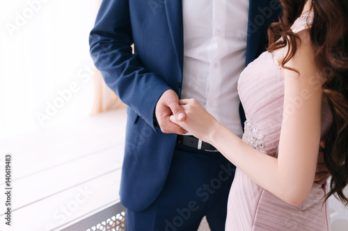 the groom holds the of the wife by a hand. Love concept  wedding day