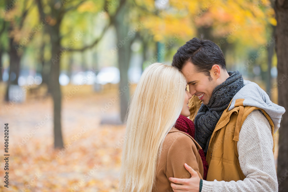 Loving couple hugging in park Loving couple hugging in park