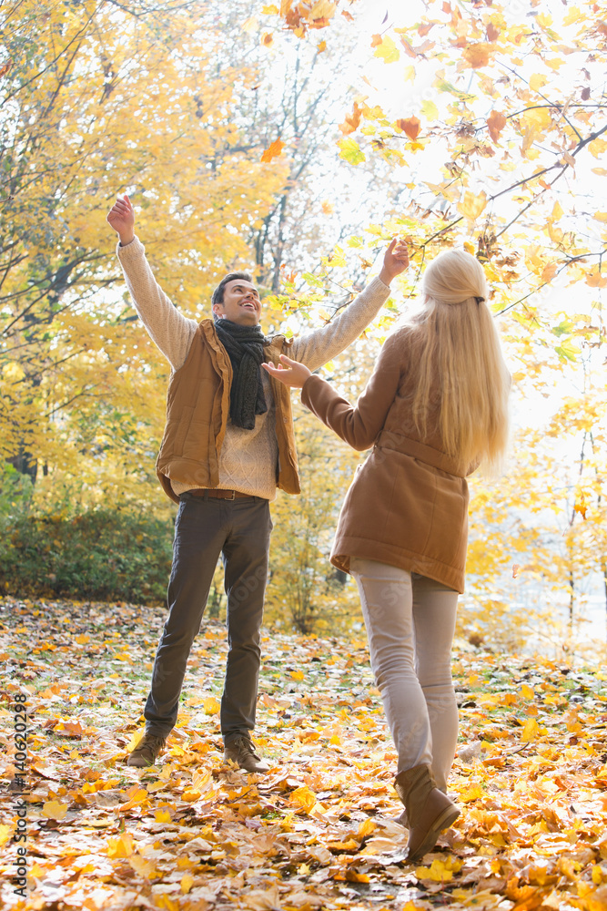 Full length of couple enjoying in autumn Full length of couple enjoying in autumn