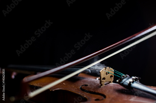 Violin detail with black background