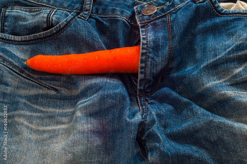 Carrot as symbol of Penis in jeans fly as concept of man health and strong  Stock Photo | Adobe Stock