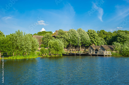 Landschaft am Wallsee mit Blick zum Wallmuseum mit Slawendorf photo