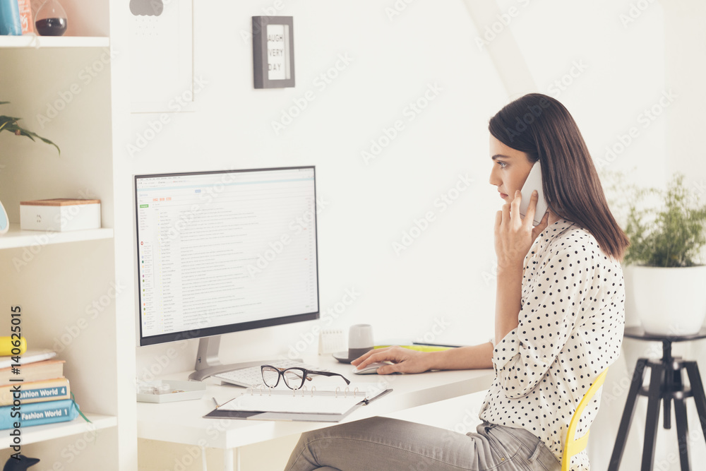 Young Beautiful Businesswoman Talking on the Phone Young Beautiful Businesswoman Talking on the Phone