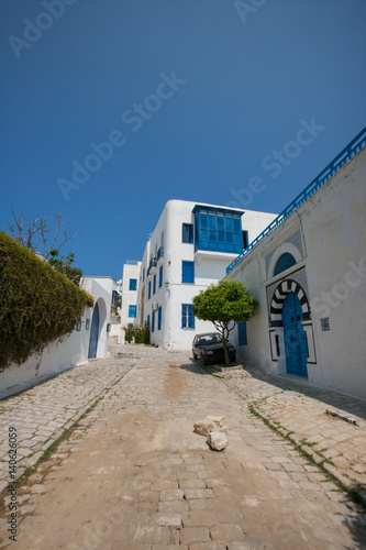 View of street and residential building against clear blue sky, Tunis, Tunisia