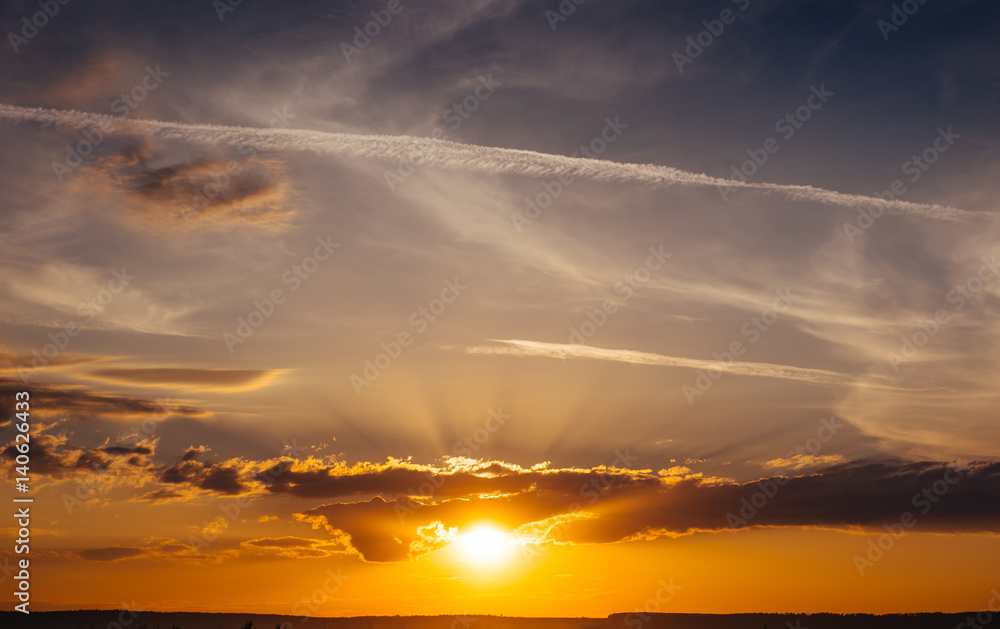 Obraz premium Sunset sunrise with clouds, light rays and other atmospheric e