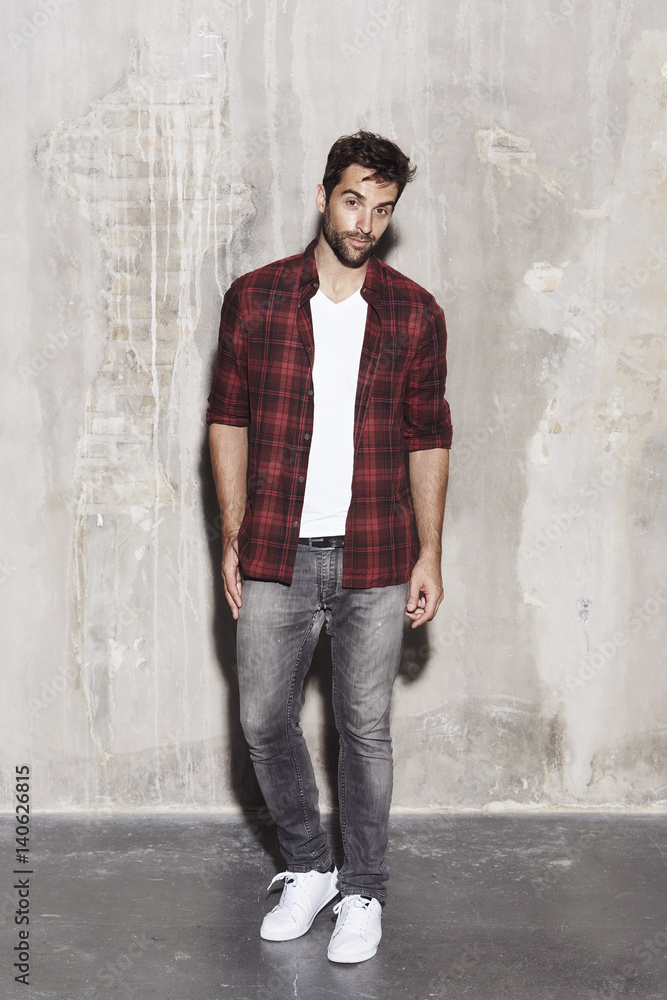 Obraz premium Checked shirt guy in jeans, portrait