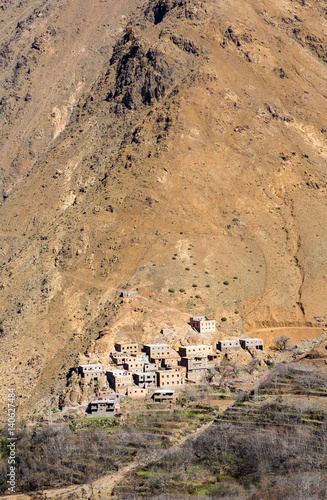 Modest traditional berber village with cubic houses in Atlas mountains, Morocco