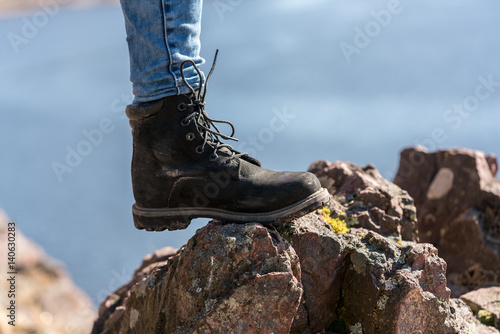 hiking in the mountains with dark boots