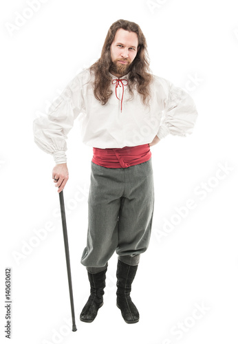 Handsome man in historical pirate costume with cane isolated