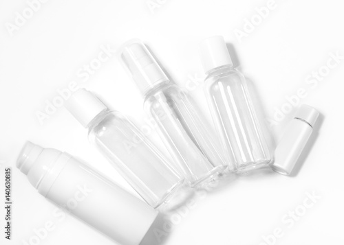 White cosmetic bottles on white background. Wellness, spa and body care bottles collection. Beauty treatment