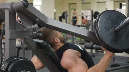 Male bodybuilder arms training. Preparing for the competition. Healthy Lifestyle slow motion photo