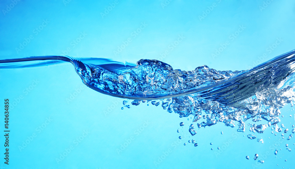 Clear blue water wawes with bubbles in the left. Clear blue water wawes with bubbles in the left.