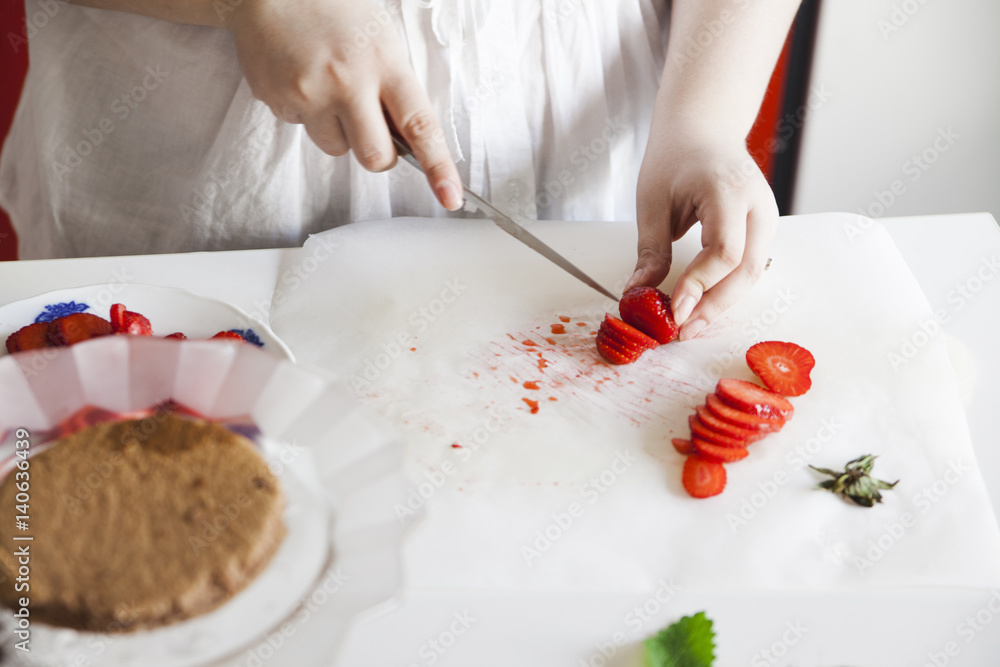 Woman Cutting Strawberries