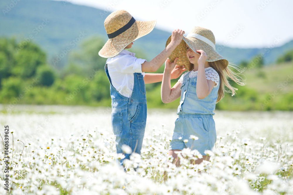 Children in a field with flowers 
