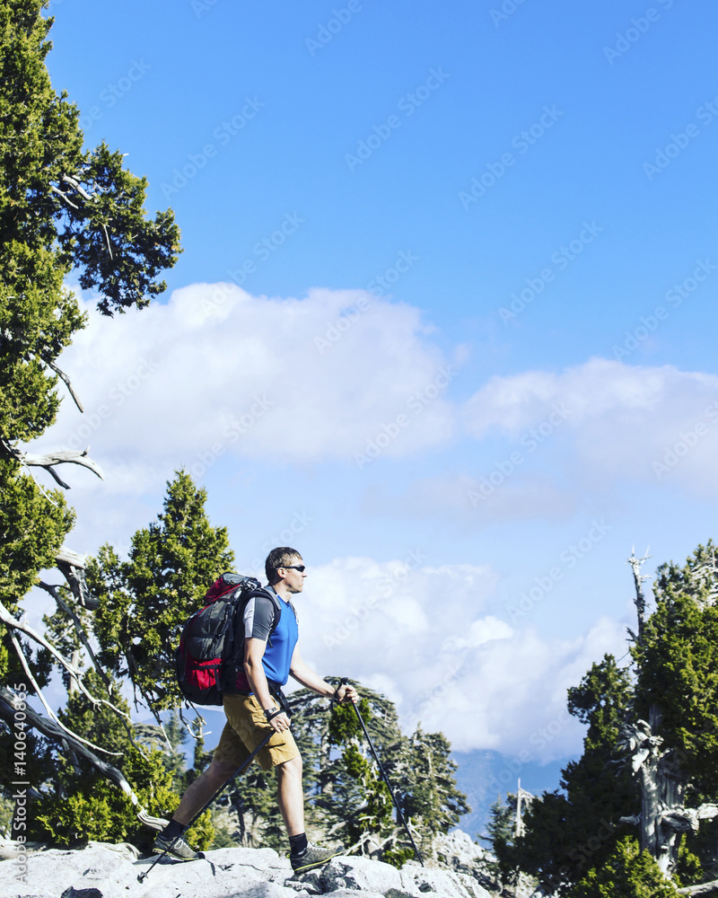 Summer hiking in the mountains with a backpack and tent. Summer hiking in the mountains with a backpack and tent.
