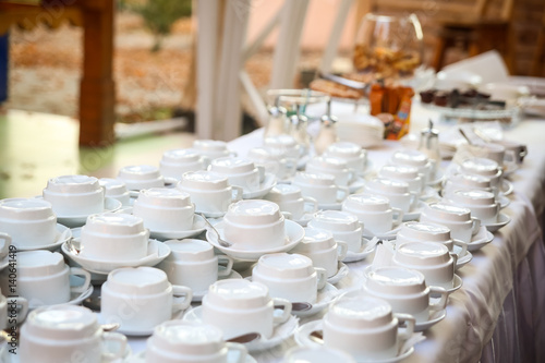 Foto tea sets, collection white coffee cups, buffet, catering