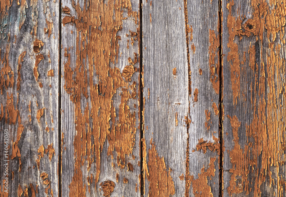 Old weathered red painted wooden wall with flaking off paint, texture pattern Old weathered red painted wooden wall with flaking off paint, texture pattern