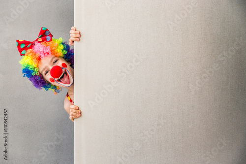 Fotótapéta Funny kid clown playing indoor