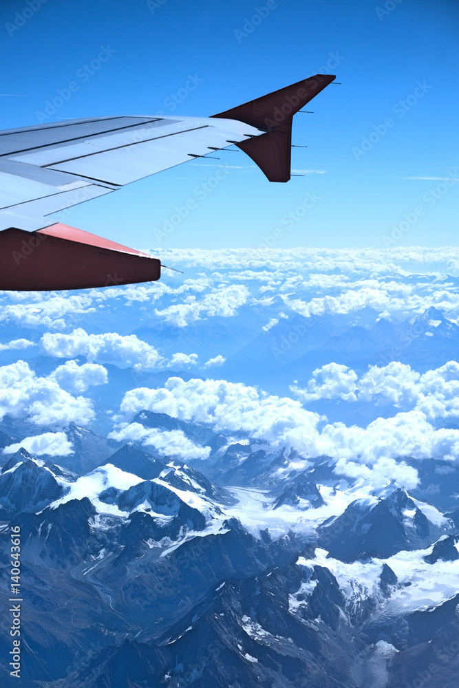 Fototapeta premium View from the plane over snowy mountains